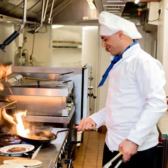 Willow Creek Chef Created Meals, chef frying a dish.