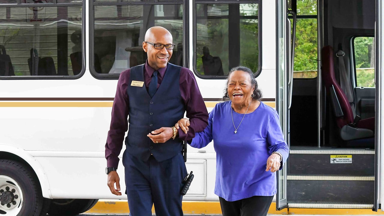 Two residents boarding the Willow Creek community bus