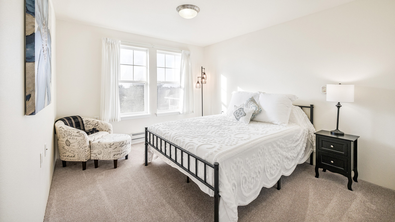 A furnished bedroom in a Willow Creek apartment