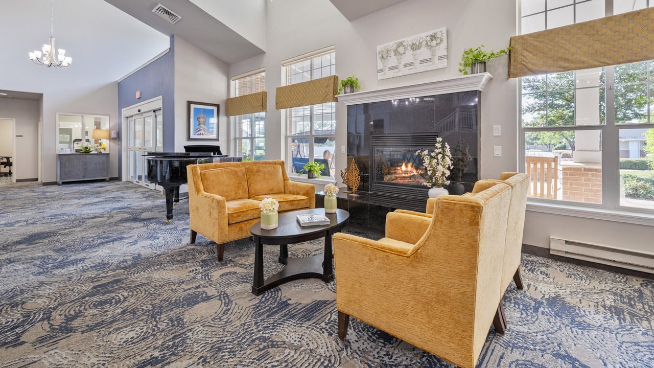 A cozy fireplace seating area off the dining room at Willow Creek