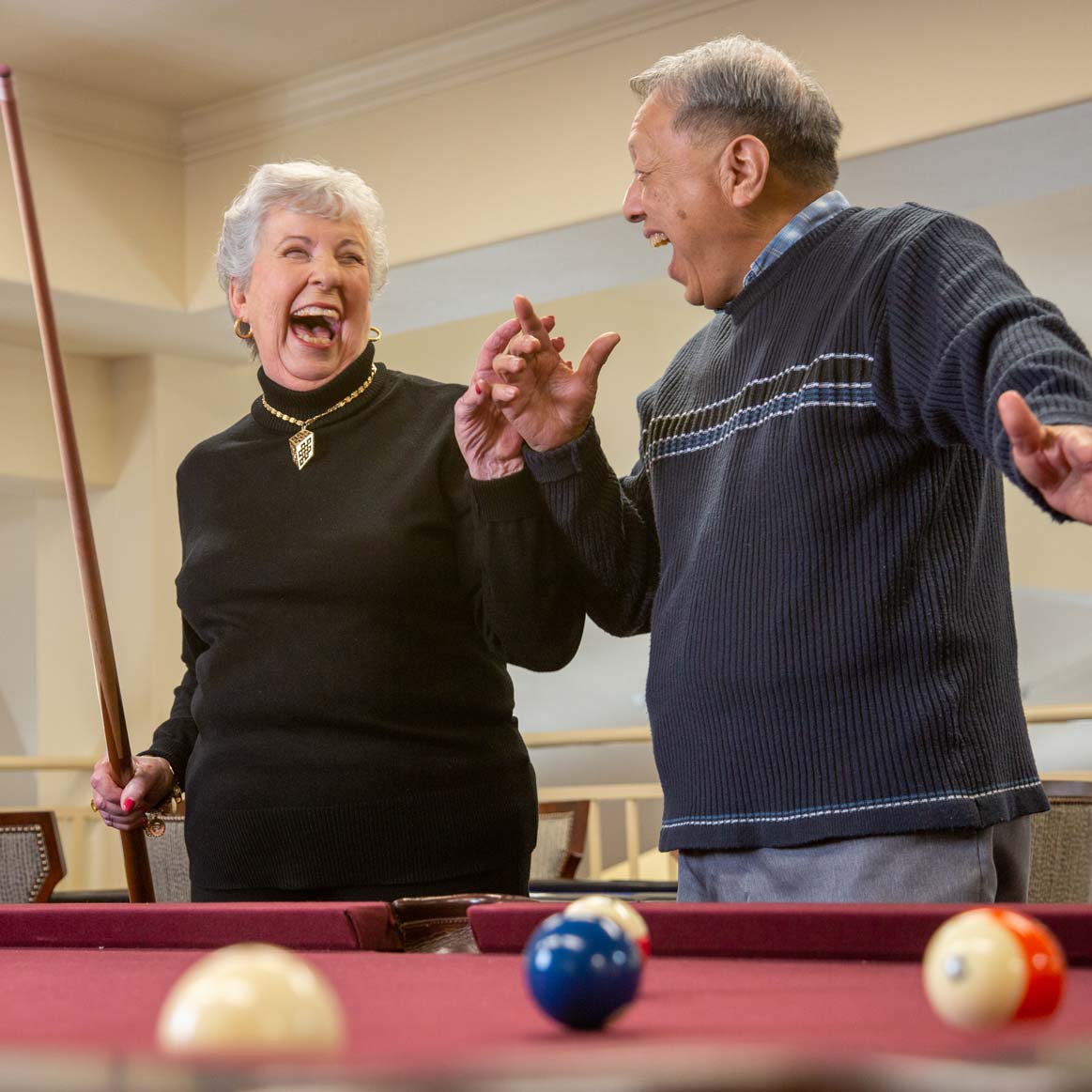 Residents playing billiards at Willow Creek